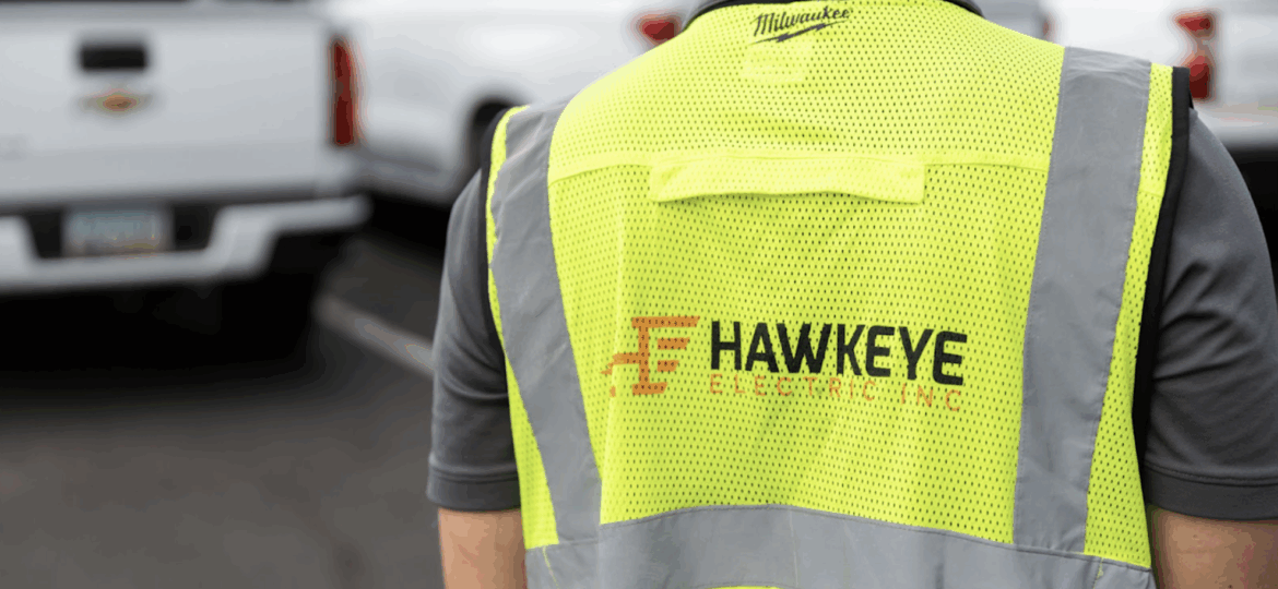 A Hawkeye employee in a work vest