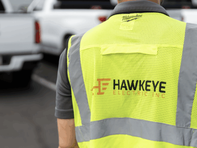 A Hawkeye employee in a work vest