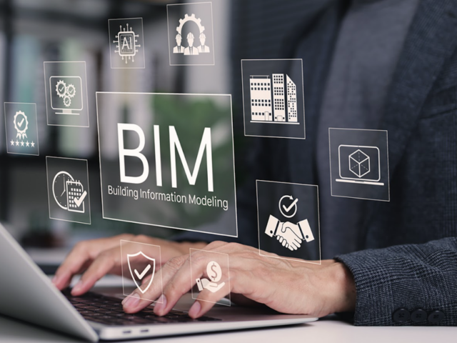 Someone typing on a computer with an icon with a BIM icon