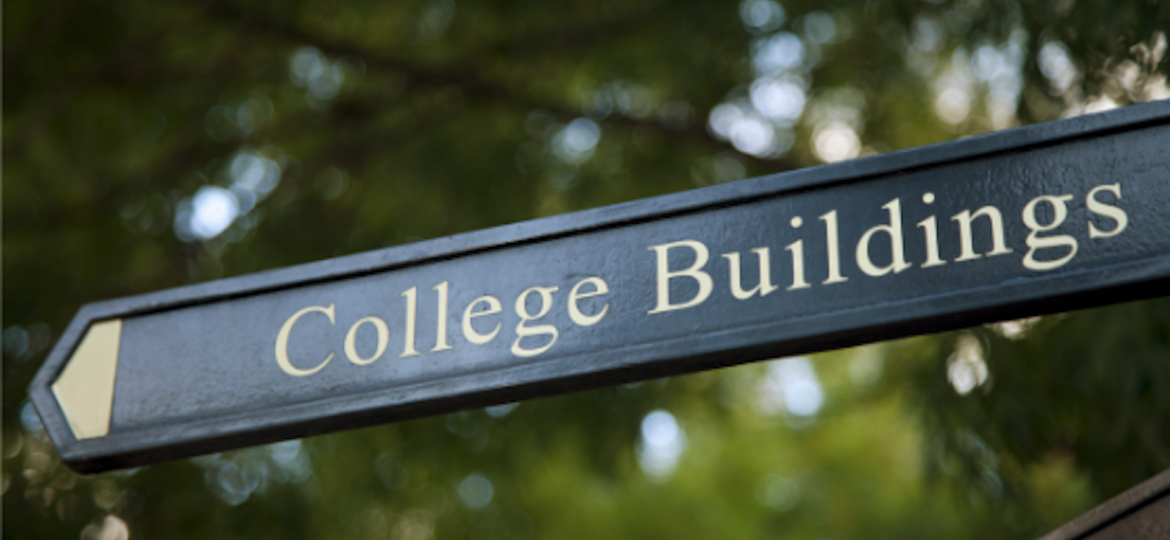 College campus sign indicating the direction to new buildings