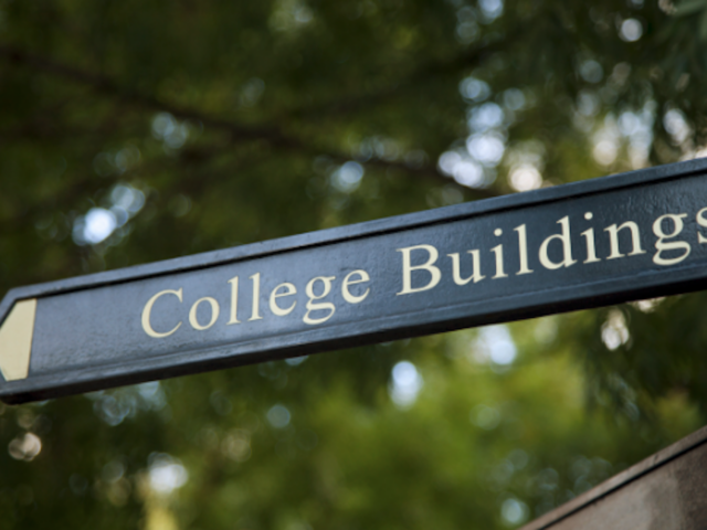 College campus sign indicating the direction to new buildings